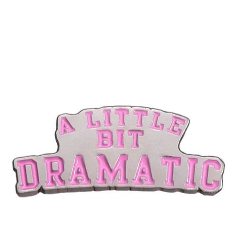 A My Cutesy Era pin featuring A LITTLE BIT DRAMATIC in pink uppercase on silver—perfect for fans of feminist enamel pins and empowered women’s gifts.