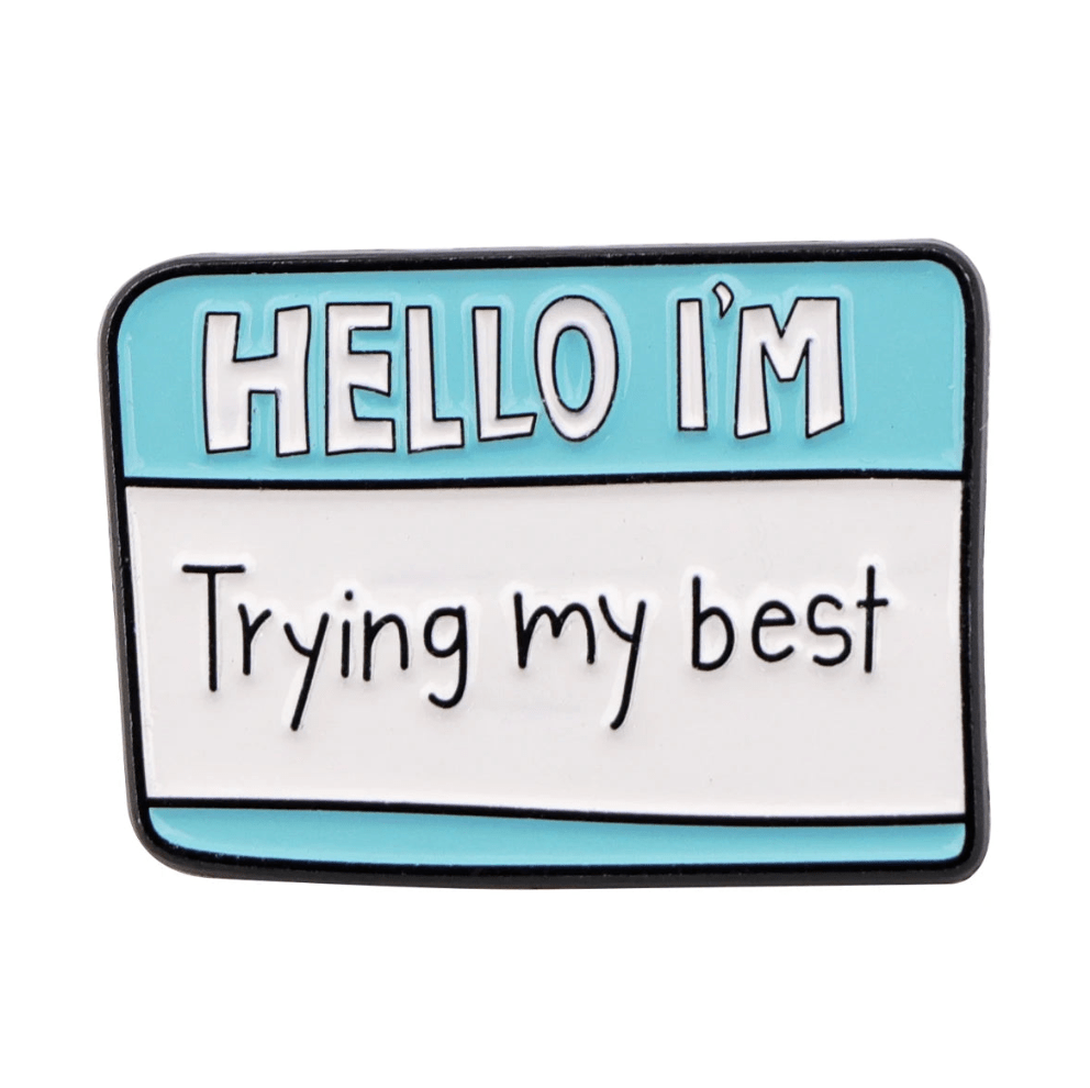 A blue and white name badge-style enamel pin by Kiss Me Later, featuring HELLO IM and Trying my best—the perfect accessory for daily motivation.