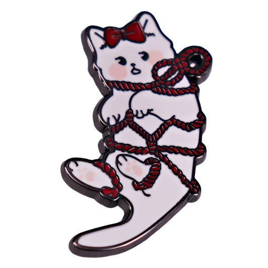 The My Cutesy Era white kitten enamel pin features a surprised cat with a red bow and red rope, making this adorable accessory a perfect addition to any collection.