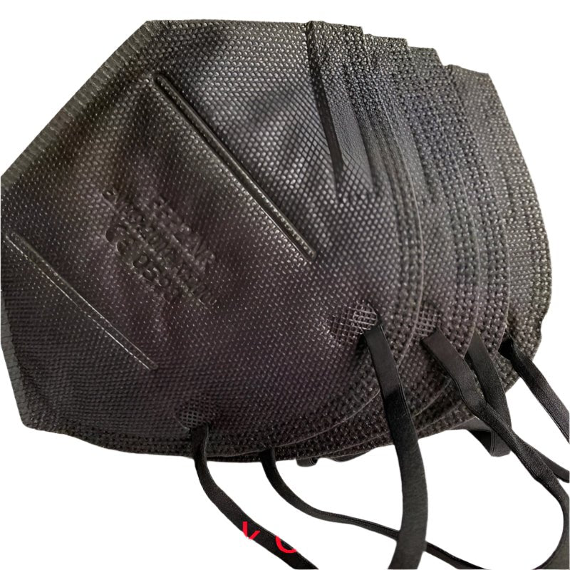 A stack of Kiss Me Later black KN95 face masks with ear loops, fanned out on a white background—ideal for bulk purchases.