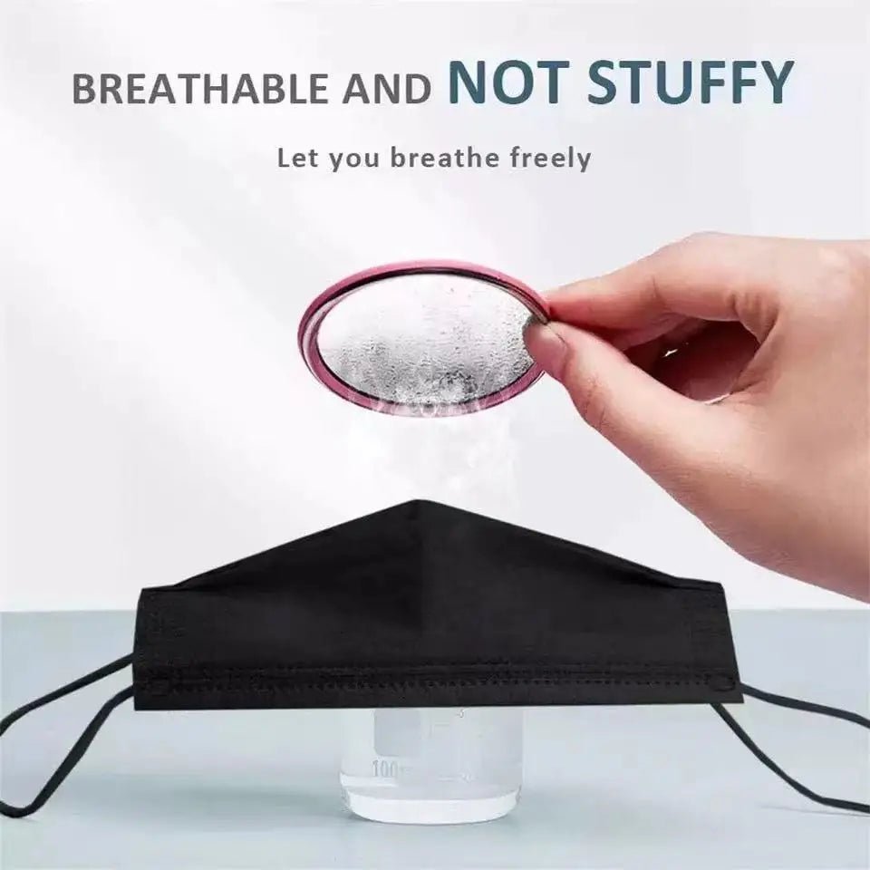 A hand holds a fogged-up glass above a steaming cup, with a Kiss Me Later triple-layer mask in between. Text above reads: BREATHABLE AND NOT STUFFY. Let you breathe freely.
