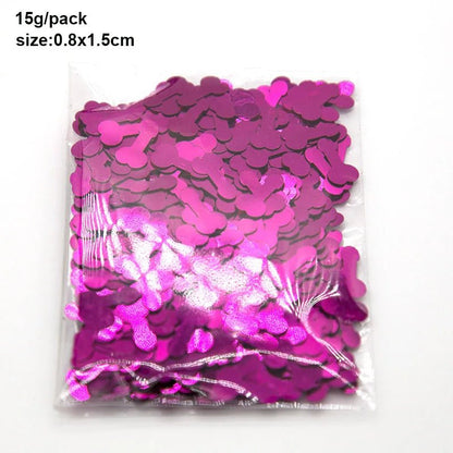 A clear plastic bag from Kiss Me Later filled with shiny metallic pink penis-shaped confetti for adults. Text above the bag reads 15g/pack and size: 0.8 x 1.5cm.
