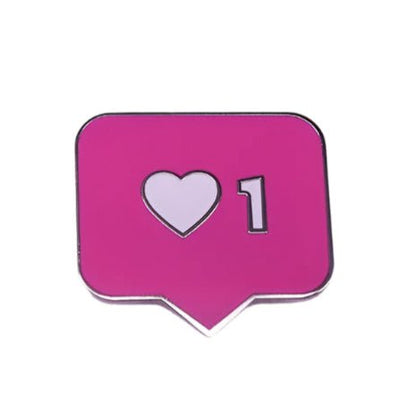 The My Cutesy Era badge is pink, shaped like an Instagram notification, and features a white heart with the number 1 to represent one like.