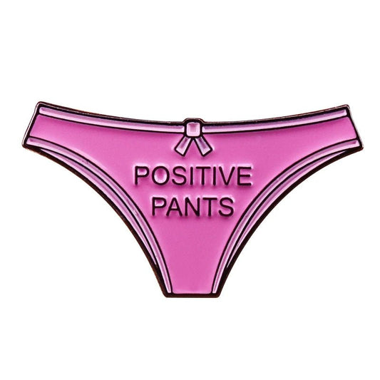 Illustration of pink panties with a small bow at the top center and POSITIVE PANTS across the front, perfect for an enamel pin 
