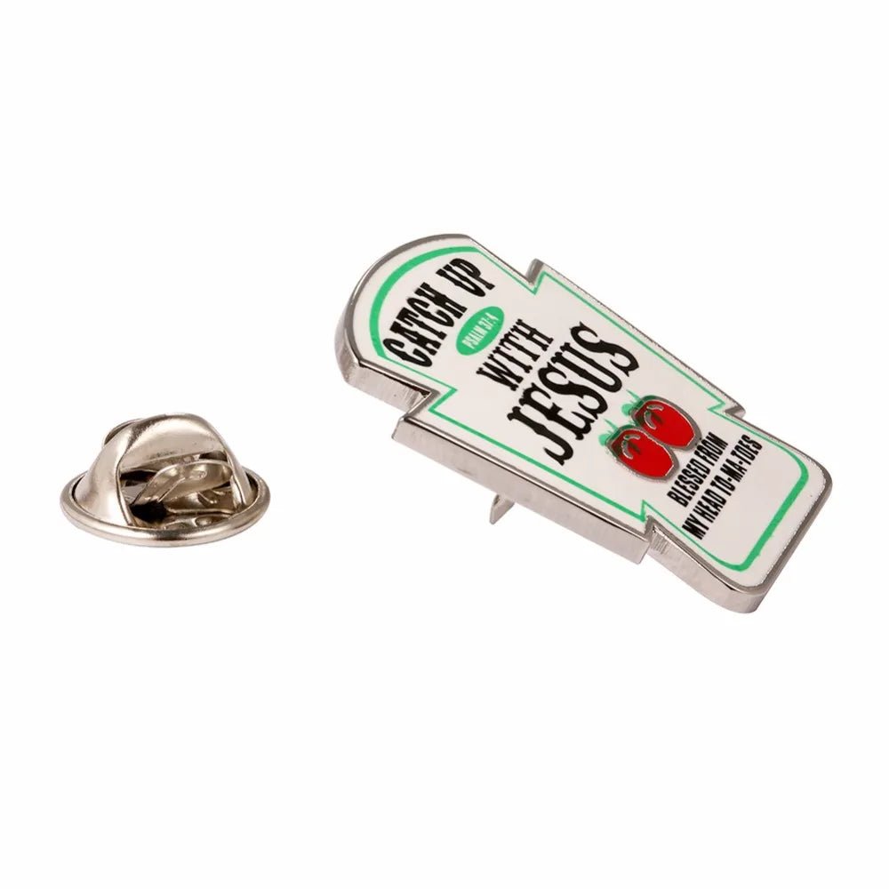 This Kiss Me Later pin features “Ketchup With Jesus” with tomatoes, plus the phrase: “Lettuce Praise and Relish Him, ‘cause He loves me from my head to-ma-toes.” Includes metal pin and backing.