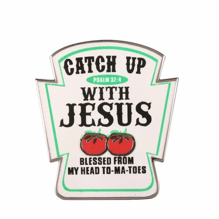 Enamel pin with text 'Catch up with Jesus' and tomato ketchup bottle graphic