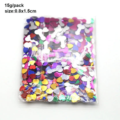 A clear plastic bag from Kiss Me Later contains colourful confetti, including metallic bone and heart shapes. Text reads: 15g/pack, size 0.8x1.5cm—perfect for adult party confetti fun.