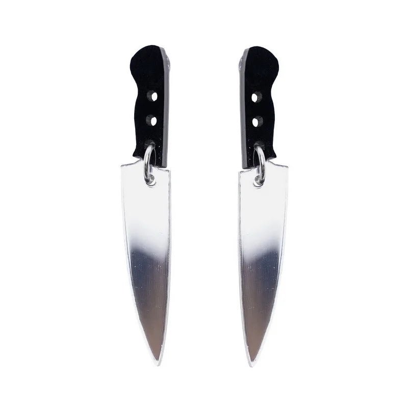 Kiss Me Later knife earrings feature kitchen knife shapes with black handles and silver blades, crafted from acrylic charms and shown side by side on a white background.