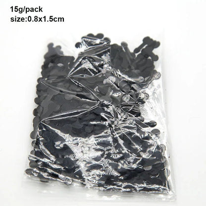 A clear plastic bag from Kiss Me Later contains small black bone-shaped confetti (0.8x1.5cm, 15g/pack). Ideal for themed events or adult parties.