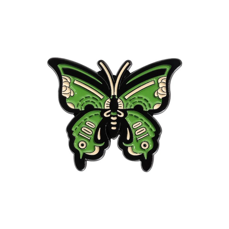 A decorative enamel pin shaped like a butterfly with green, black, and beige stylized wings—boldly outlined and perfect for your pink toaster enamel pin collection.