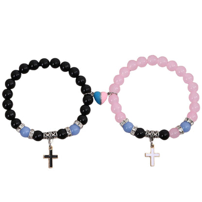 Two beaded bracelets with cross charms and pink and blue magnetic heart for christian couples