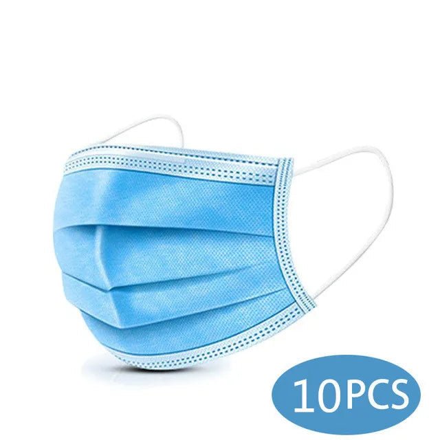 A light blue Kiss Me Later disposable medical face mask with white ear loops. In the bottom right corner, a blue oval with white text reads 10PCS, indicating a pack of ten triple-layer masks.