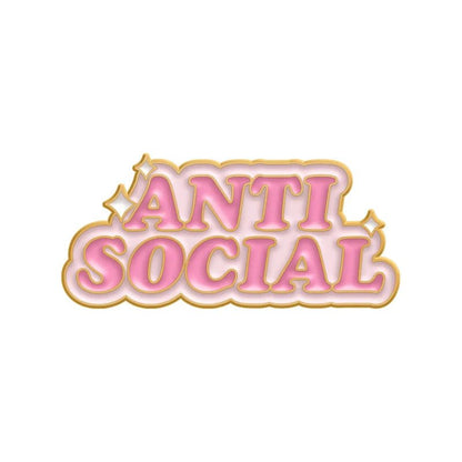 The My Cutesy Era pink and gold enamel pin features “ANTI SOCIAL” in bold uppercase letters, gold outline, and sparkling accents—a motivational mental health accessory for a unique statement.