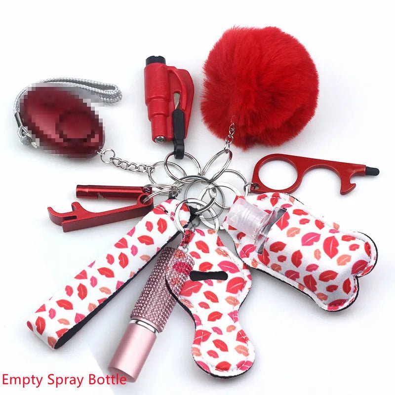 Kiss Me Later keychain set with red and white lip print personal safety accessories—pom-pom, lipstick case, alarm, hand sanitizer bottle, touch tool, and more—plus “Empty Spray Bottle” in red text on a white background. Perfect for outdoors.