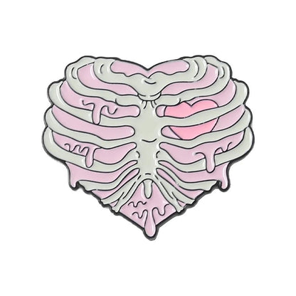 A heart-shaped ribcage illustration with pink accents and a small heart, featuring a melting effect—perfect to pair with your favorite skull pin for an edgy statement. 