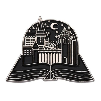 The My Cutesy Era black and silver enamel pin features an open book with a castle, stars, and crescent moon—a magical accessory for book lovers and the perfect gift for any bookworm’s collection.