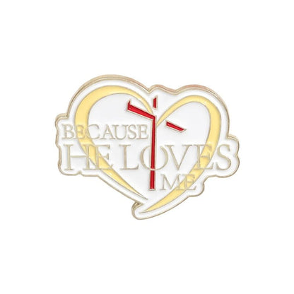 Kiss Me Laters heart-shaped enamel pin features a yellow outline, red cross, and Because He Loves Me text—a cute pink accessory perfect for expressing your faith.