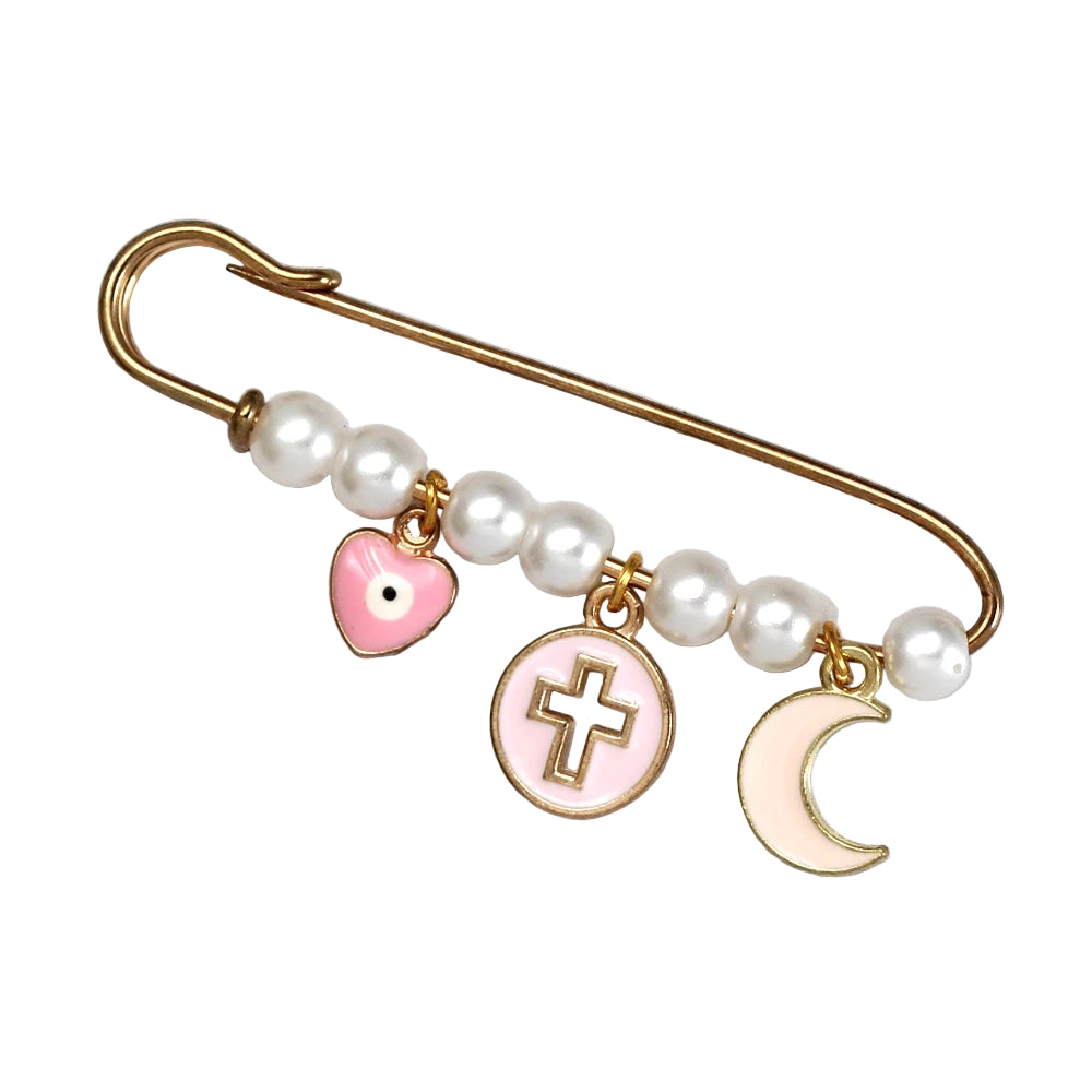 Kiss Me Later’s gold brooch features white pearls and three dangling charms—a pink heart, a round pink medallion with a gold cross, and a white crescent moon—making it a perfect baby shower gift. Displayed on a light gray background.