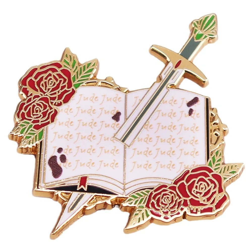 Enamel pin for Romance Readers features a gold-edged open book with Jude on its pages, red roses, and a diagonal sword—ideal for book lover badge collections.