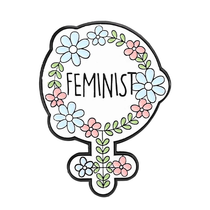 Enamel pin features the female gender symbol, adorned with blue and pink flowers and green leaves, with FEMINIST in the center—a bold accessory for any feminist pins collection.