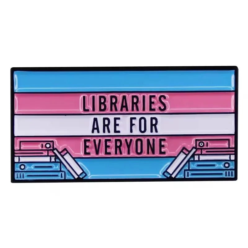 A My Cutesy Era enamel pin features the transgender pride flag colors, the phrase Libraries Are For Everyone, and book illustrations—an ideal accessory for any book lover.