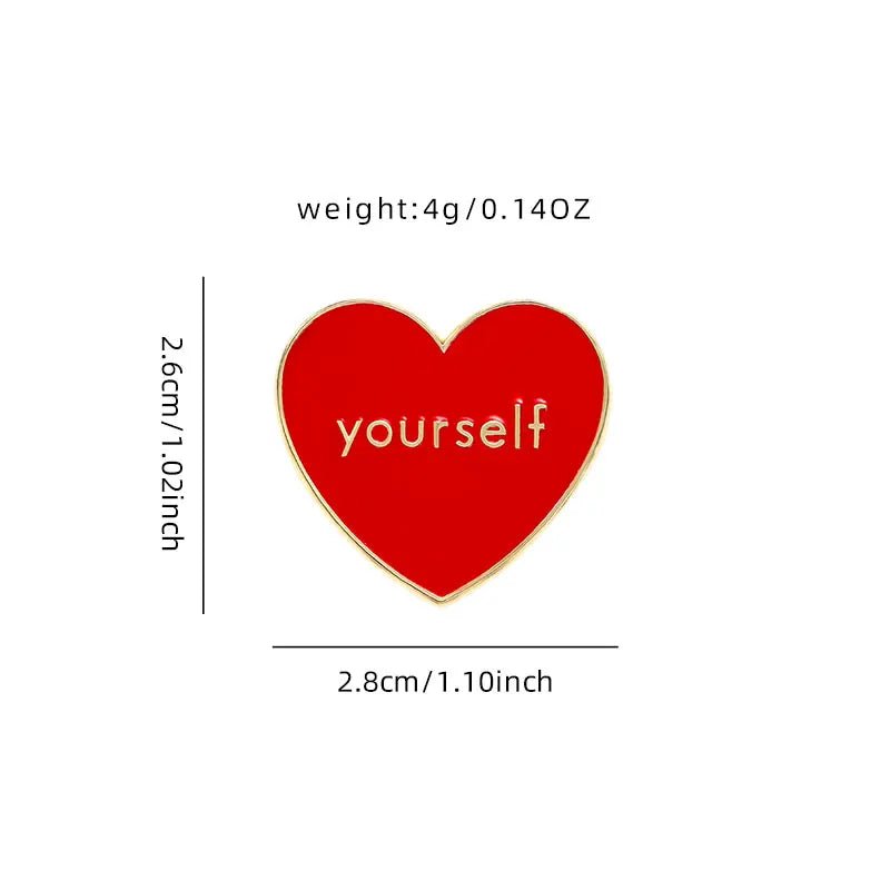 The Kiss Me Later red and gold heart-shaped enamel pin features yourself in the center, measures 2.6 x 2.8 cm (1 x 1.1 in), and weighs 4g (0.14 oz)—the perfect Love Yourself enamel pin for any collection.