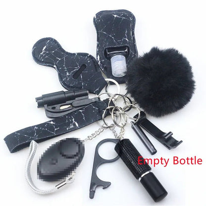 The Kiss Me Later black marble keychain set includes a pom-pom, alarm, whistle, touch tool, flashlight, and key rings—perfect for outdoors. “Empty Bottle” is shown in red text next to the small bottle holder.