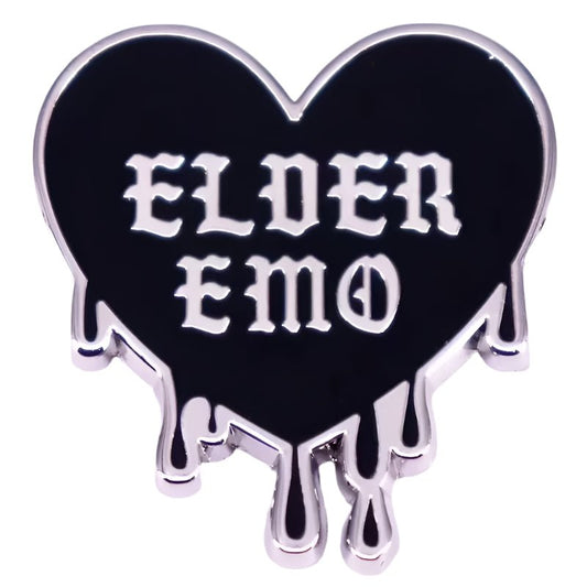 black heart-shaped pin with silver trim and dripping edges features bold, gothic white ELDER EMO text—perfect to pair with your favorite Gothic spider pin.