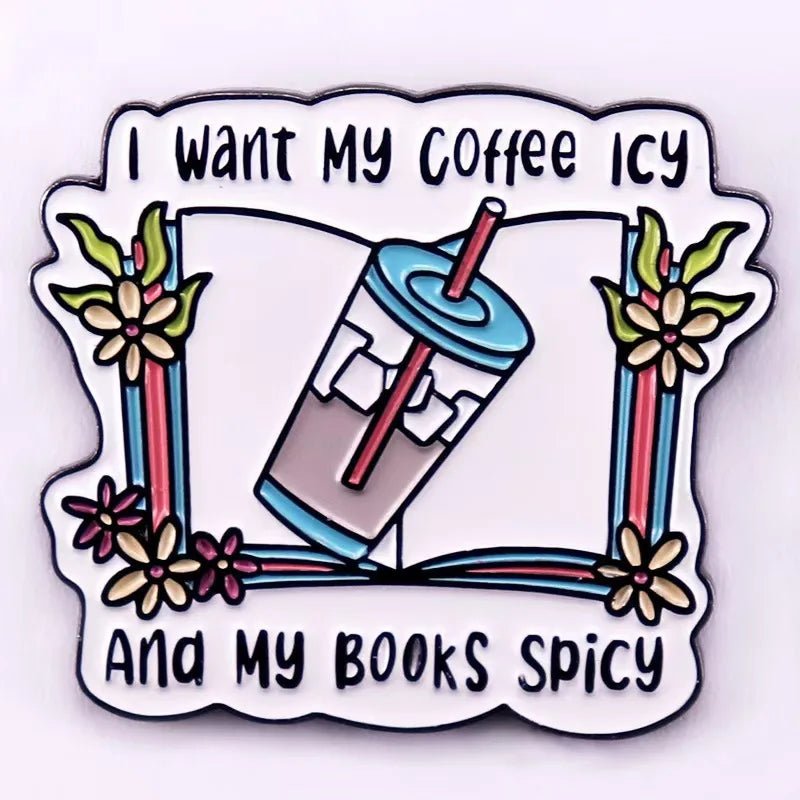 A colorful enamel pin features a cup of iced coffee with a straw, flowers, and the phrase: I want my coffee icy and my books spicy—perfect for any Romance Reader.