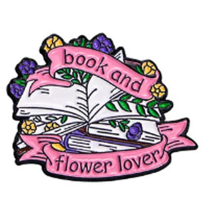 A fashion accessory featuring open books with green leaves, colorful flowers, and pink book and flower lover banners—ideal for Romance Readers or as inspiration for enamel pins and book lover badges.