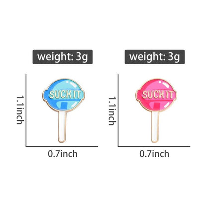 Two colorful enamel pins, one blue and one pink, each labeled SUCK IT. Each pin measures 1.1” tall × 0.7” wide and weighs just 3g, with text boxes highlighting the dimensions and weight for each accessory.