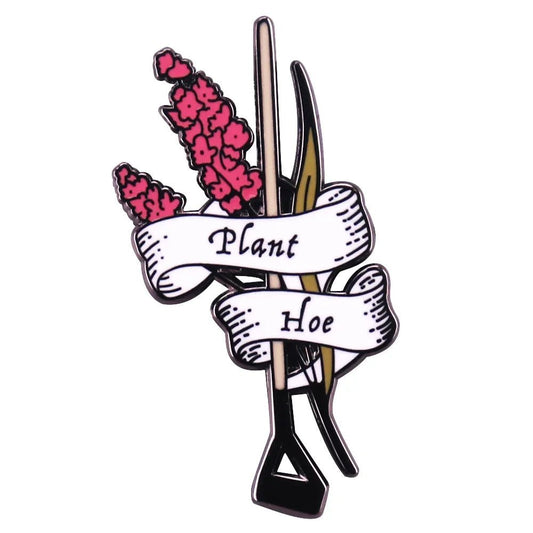 The My Cutesy Era enamel pin features pink flowers, a gardening hoe, and a white ribbon with Plant Hoe—a charming addition to any floral pin collection.
