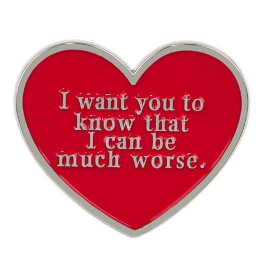 Enamel pin features a red love heart with silver edges and raised silver text: I want you to know that I can be much worse.