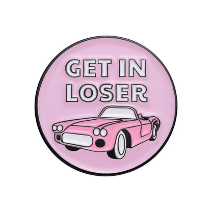 Round pink enamel pin features a cartoon convertible and bold “GET IN LOSER” text above—perfect for Mean Girls fans and enamel pin collectors.