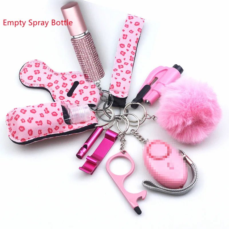 The Kiss Me Later keychain set includes pink personal safety accessories: pom-pom, safety alarm, no-touch tool, lipstick, empty spray bottle, lip balm holder, and chapstick holder—ideal for outdoor adventures and daily use.