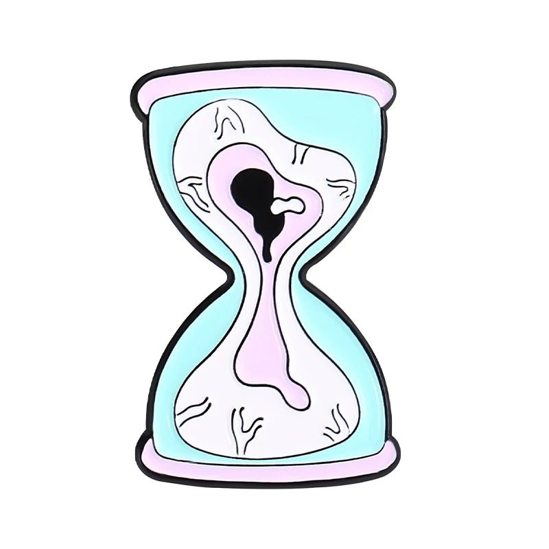 A stylized, cartoon-like hourglass features pastel pink and blue colors, abstract wavy lines for a melted look reminiscent of quirky skull enamel pins, all set against a plain white background.