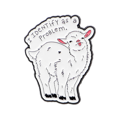 A enamel pin features a cartoon-style white goat with pink ears, a playful expression, and a red love heart, standing under the text I IDENTIFY AS A PROBLEM.