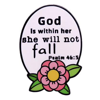 My Cutesy Era’s floral enamel pin features a white oval egg shape with a pink flower and the phrase “God Is Within Her She Will Not Fall - Psalm 46:5.”.