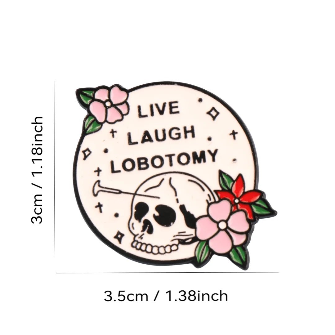 A Gay Skate round enamel pin with a skull and LIVE LAUGH LOBOTOMY in bold black text. Measures 3 cm x 3.5 cm (1.18 in x 1.38 in), illustrated with clear measurement lines.