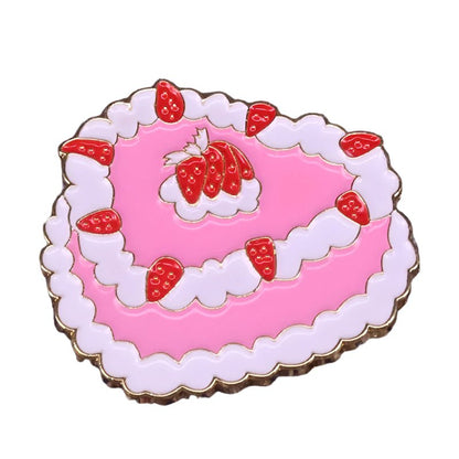The My Cutesy Era vintage enamel pin features a heart-shaped pink cake with white icing, red strawberries, gold edges, and a charming layered design.