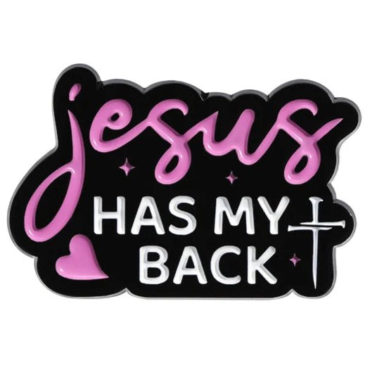 1-inch enamel pin features “Jesus Has My Back” in pink and white on black with a heart, cross, and stars—a stylish way to show your faith.
