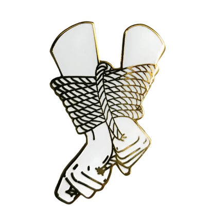 Illustration of two hands with wrists bound by rope in black, white, and gold outlines on a plain background—ideal for a two hands bound pin or rope pin design from My Cutesy Era.
