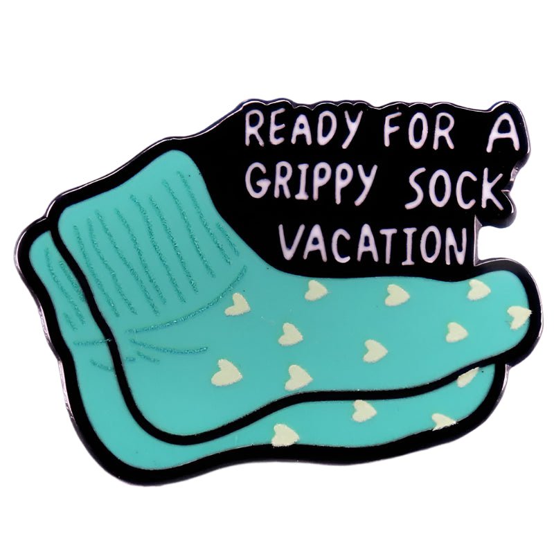 The My Cutesy Era enamel pin features teal socks with yellow hearts and the phrase Ready for a grippy sock vacation—a fun, collectible accessory for pin lovers.