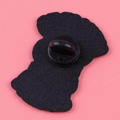 A black pin backing with a butterfly clutch is displayed on a pink surface, showing the rear side of the Menace To Society enamel pin.