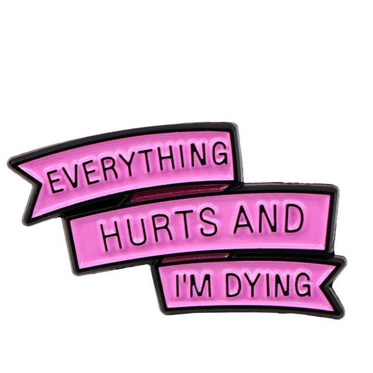 My Cutesy Era enamel pin with three stacked pink ribbons reads EVERYTHING HURTS AND IM DYING in bold black letters. Ships worldwide.