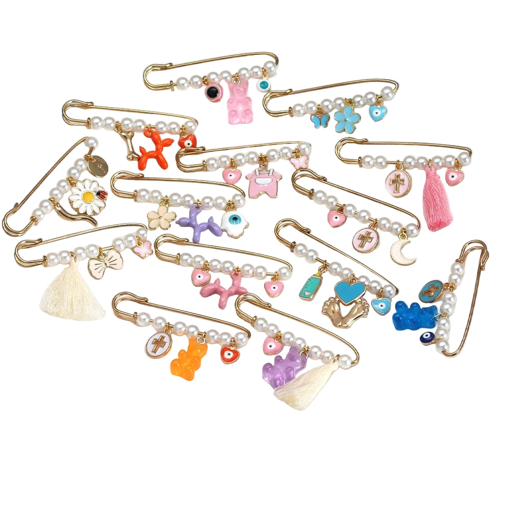 Collection of decorative safety pins with various charms