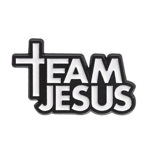 A black and white pin reads “Team Jesus,” featuring a cross-shaped T in Team.
