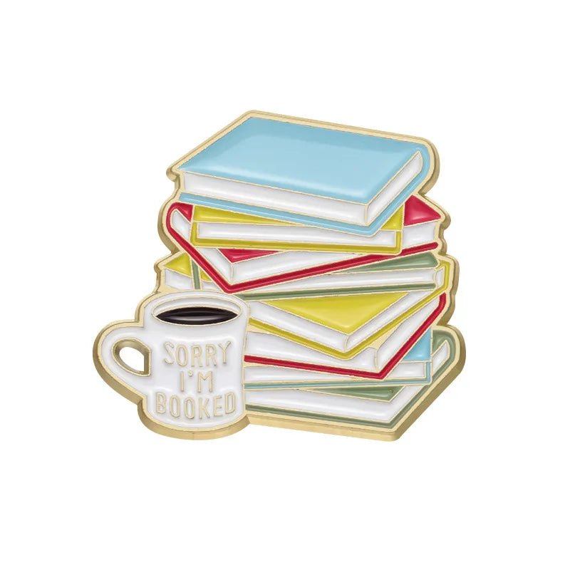 A stack of books, a coffee mug, and My Cutesy Era’s adorable book pins—ideal cozy bookworm accessories and thoughtful gifts for book lovers.