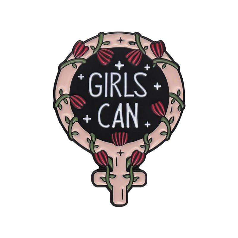 Enamel pin features a stylized Venus symbol with flowers, vines, and GIRLS CAN in white on black—a bold, empowering accessory for any feminist pins collection.