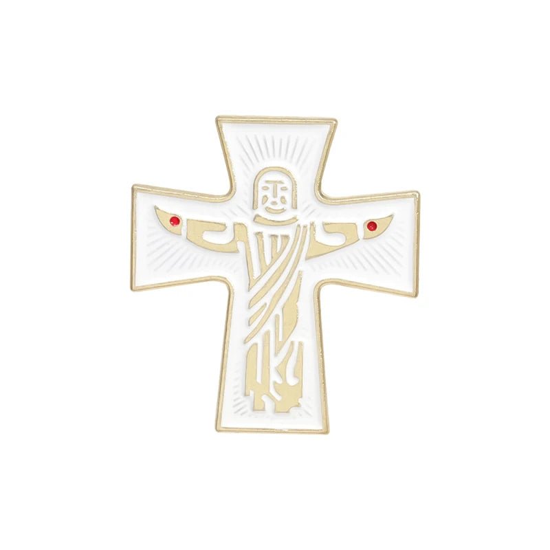 The Kiss Me Later enamel pin is white and gold, shaped like a cross, and features a stylized Jesus with outstretched arms and two small red dots on each side.